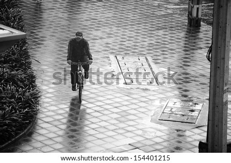 Bicycle ride on the pedestrian walkway after rains