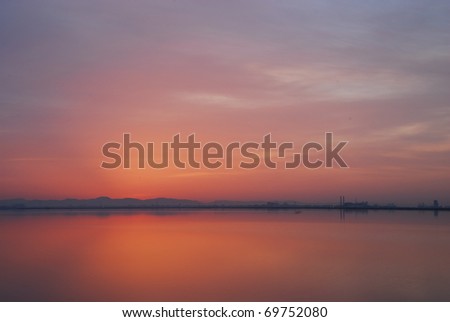 Red sky before sunrise in the Morning at Tunis lake
