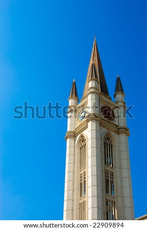 Clock Tower isolated over blue sky.