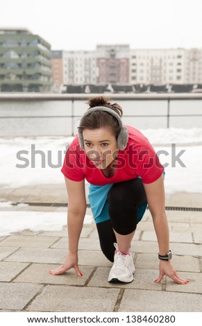 young woman in start position