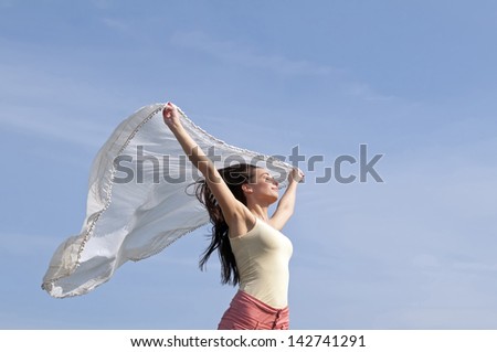 woman with flying scarf