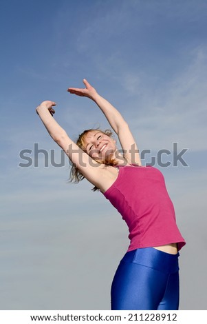 woman feeling free with arms wide open
