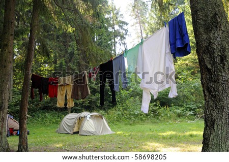 tents and clothesline on a meadow