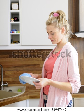 housewife washes dishes