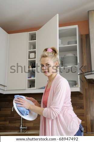 housewife washes dishes
