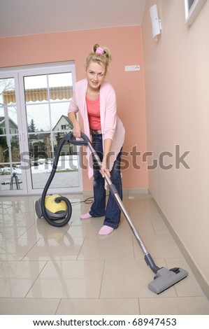 housewife with vacuum cleaner