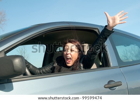angry young woman screaming in the car
