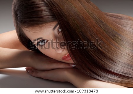 Portrait of Beautiful Woman with smooth gloss long hair