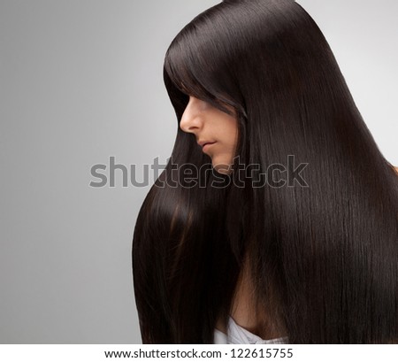 Black Hair. Portrait of Beautiful Woman with Long Hair. Good quality retouching.