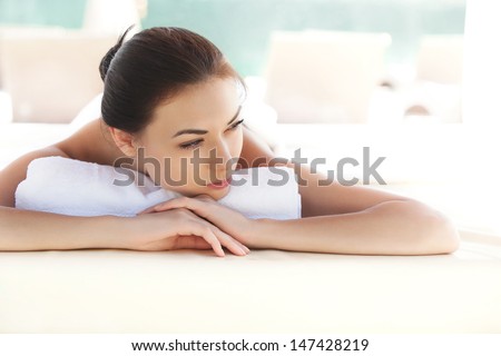 Spa Woman. Beautiful Young Woman Relaxing After Massage. Spa Salon.