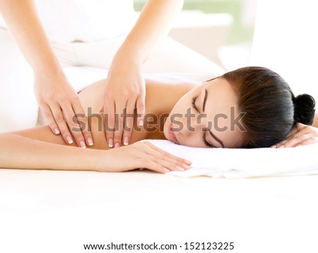 Spa Woman. Close-up of a Beautiful Woman Getting Spa Treatment. Massage