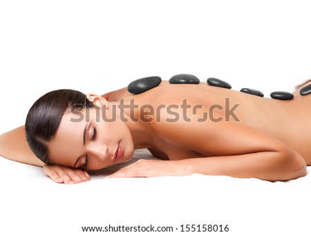 Stone Massage Beautiful Woman Getting Spa Hot Stones Massage in Spa Salon Stone Massage Beautiful Woman Getting Spa Hot Stones Massage in Spa Salon