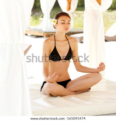 Young and Beautiful Woman Doing Yoga Exercises . Yoga Background