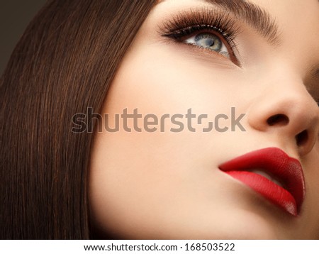 Woman Eye With Beautiful Makeup And Long Eyelashes. Red Lips. High Quality Image.
