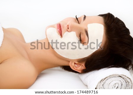 Spa Mask. Woman in Spa Salon. Face Mask. Facial Clay Mask. Treatment