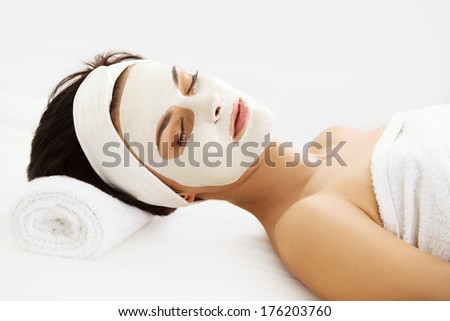 Cosmetic Mask Beautiful Young Woman Getting a Beauty Treatment in Spa Salon Isolated on White Backround Cosmetic Mask Beautiful Young Woman Getting a Beauty Treatment in Spa Salon Isolated on White Backround