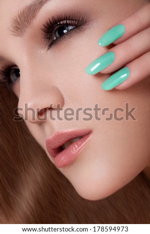 Manicure and Make-up. Beautiful Woman With Colorful Nails and Luxury Makeup. Beautiful Girl Face