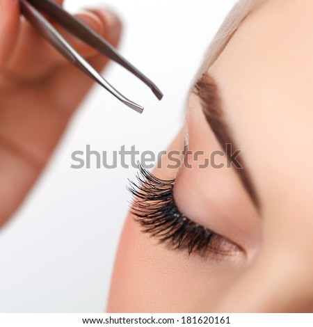 Woman eye with long eyelashes. Eyelash extension. Eyebrow