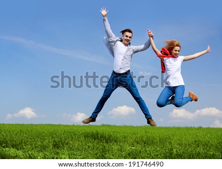 Happy couple jumping. Freedom concept. Free. Jumping People. Fun