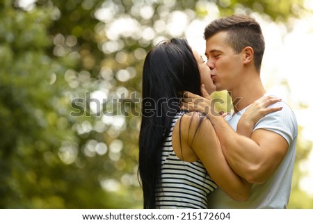 Kissing couple. Portrait of young caucasian couple kissing