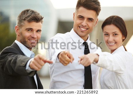 Business People pointing at you.