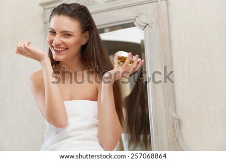 Beautiful Woman Sniffs Her Perfume