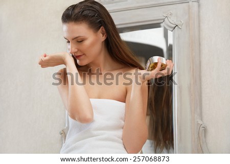 Beautiful Woman Sniffs Her Perfume