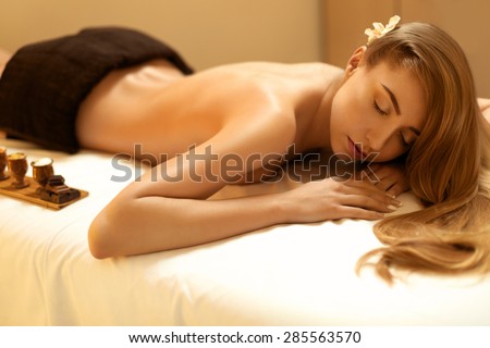 Spa Woman. Blonde Gets Recreation Treatment in Spa Salon. Wellness Concept