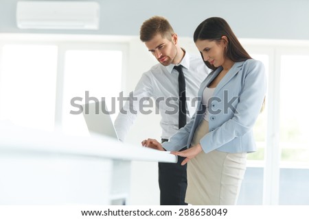 Business People Using Laptop Computer at Ofiice