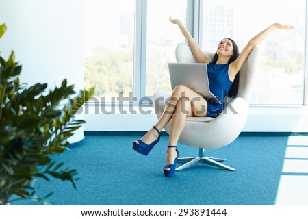Business woman celebrates successful deal at office. Bussiness People