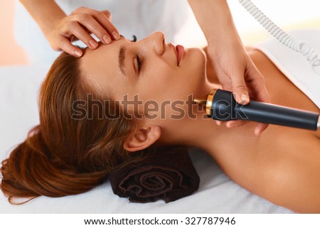 Face skin care treatment. Ultrasound cavitation face care procedure in medical beauty cosmetology spa center.