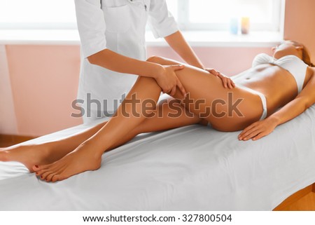 Woman legs. Body care. Beautiful woman getting leg massage treatment in spa salon. Skin care, wellbeing, wellness, lifestyle, relaxing procedure.