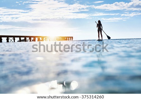 Summer Water Sports. Silhouette Of Free Fit Woman Paddling, Stand Up On Paddle, Surf Board In Sea. Holidays Travel Vacation. Healthy Lifestyle. Recreation. Leisure Activity. Freedom, Wellness Concept