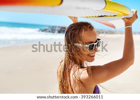 Summer Fun On Holidays Travel Vacation. Surfing. Sexy Beautiful Surfer Girl In Bikini With Surfboard. Healthy Lifestyle. Extreme Water Sports. Summertime Leisure Activity. Hobby. Wellness Concept