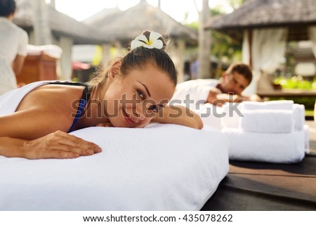 Romantic Couple Spa. Closeup Of Beautiful Healthy Happy Smiling Woman, Handsome Man Relaxing At Day Spa Resort. People Enjoying Body Relaxation Massage Outdoors In Summer. Relax Treatment Concept