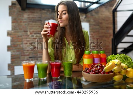 Fitness Food. Healthy Eating Woman On Diet Drinking Fresh Detox Juice, Smoothie For Breakfast. Closeup Of Beautiful Smiling Girl With Fruits And Weight Loss Drinks At Kitchen Table. Nutrition Concept