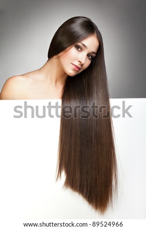 Portrait of young beautiful woman with long glossy hair Portrait of young beautiful woman with long glossy hair