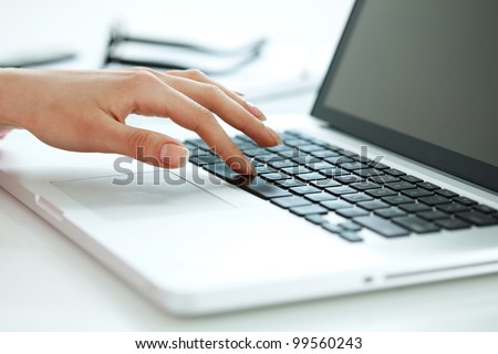 Closeup portrait of woman\'s hand typing on computer keyboard