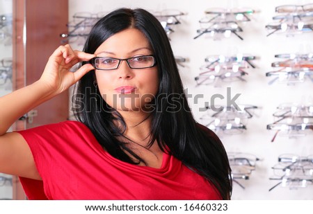 stock-photo-the-brunette-tries-glasses-16460323.jpg