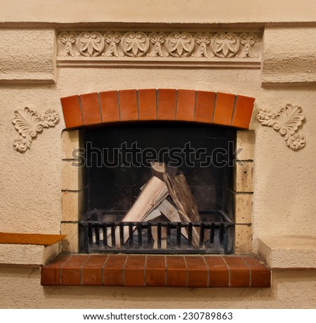 The firewood in beautiful old fireplace in home