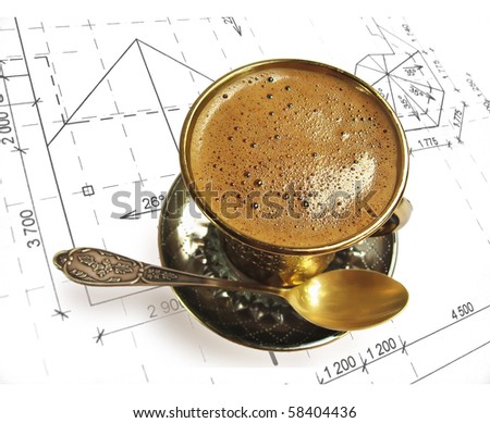 cup of aromatic coffee with some bubbles on background of the drawing. Shallow depth of field