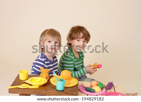 Kids, children cooking and playing with pretend food, sharing and nutrition concept