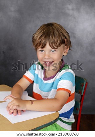 Child laughing, with blank page, learning, school or education concept