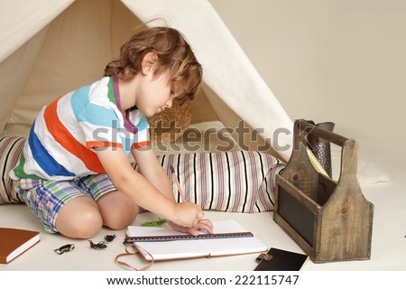 Child learning and education during indoor play: drawing and writing