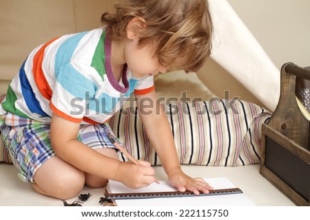 Child learning and education during indoor play: drawing and writing
