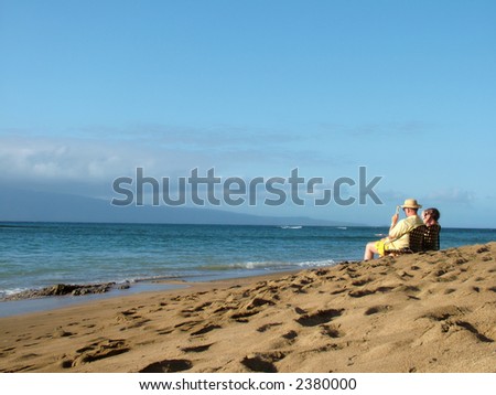 Elderly couple enjoying afternoon on a beach