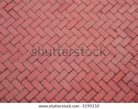 Red brick tiling on a floor, walkway or wall. Could be used as texture, background, pattern