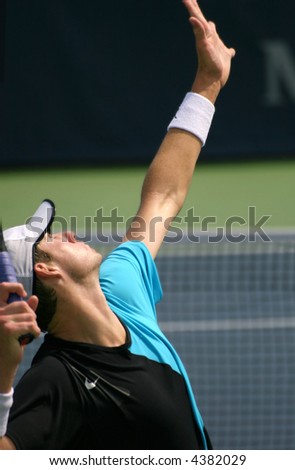 Unique shot of John Isner, a rising pro tennis star, serving at Leggmason 2007. It was his first big pro tournament where he got defeated in the final by Andy Roddick.