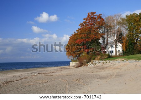 House on the beach, seasonal image, fall colors, deep blue sky