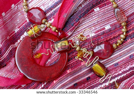 Red earrings and necklace: image suitable for advertising handmade crafts, jewelry business